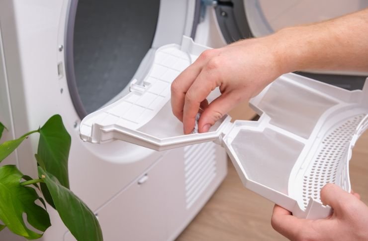 A person engages with a washing machine door, symbolizing appliance repair services available in Las Vegas, NV.